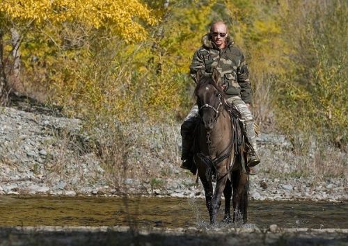 Russia's Prime Minister Putin rides a horse as he takes part in an expedition to Ubsunur Hollow Biosphere Preserve to inspect the snow leopard's habitat in Tyva Republic in the Siberian Federal District